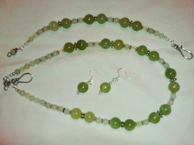 A pretty green and yellow jade necklace, earrings and bracelet set that I made with those little bitty beads I talked about earlier. See the chart below to find out what my base cost is for this set.