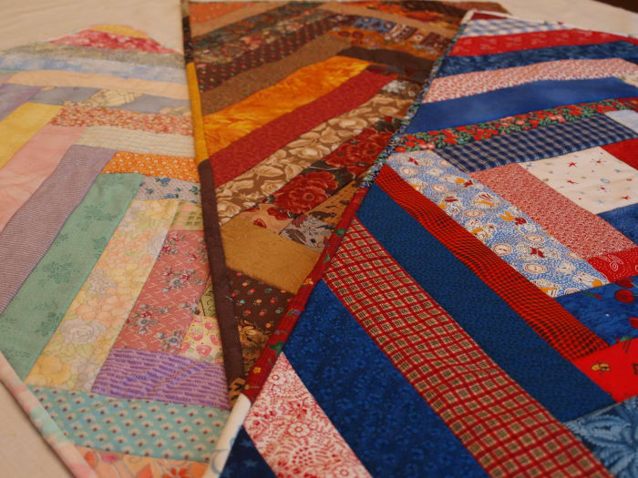With a quick change of fabric colors, this table runner can be made for any occasion. Pastels are perfect for spring, browns are great for the fall, and red, white and blue gives the project a patriotic feel.