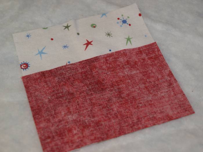 Adding the first strip of fabric. The length of the fabric should match the measurement of the side of the square.