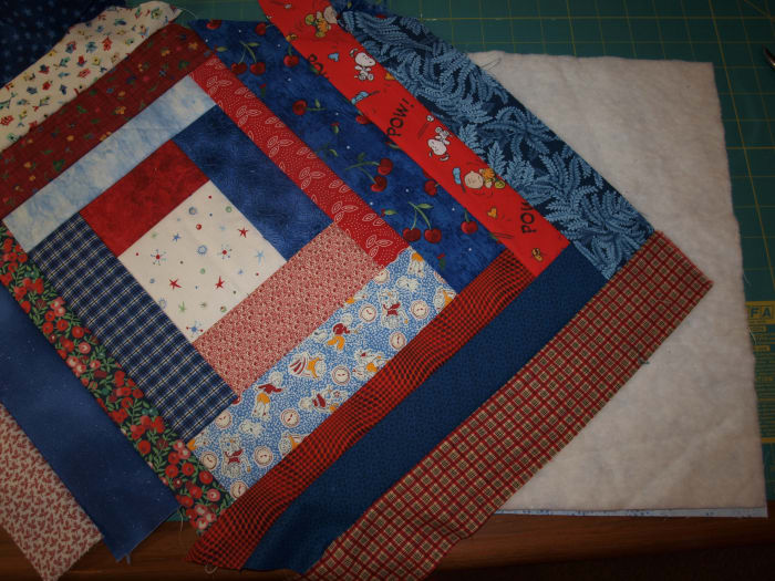 Continue adding strips. Note the overhang along the edges. That will be trimmed away once sewing is finished.