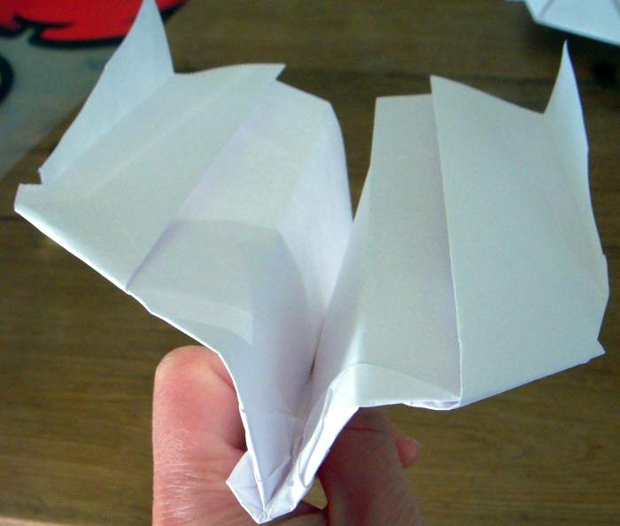 My first plane, following Airplane Guy's directions, was not perfect, but still resulted in a breathtakingly fun paper boomerang plane.