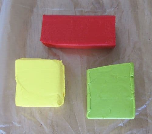 Choose three coordinating colors of polymer clay for your flower jewelry: two main colors and an accent.