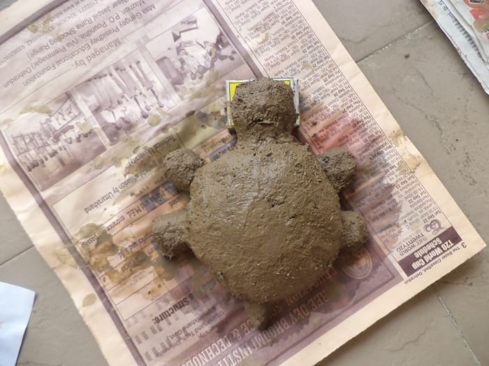 The Tiny Tortoise. Dry it in a piece of waste paper. It will prevent the paperweight from sticking with the ground