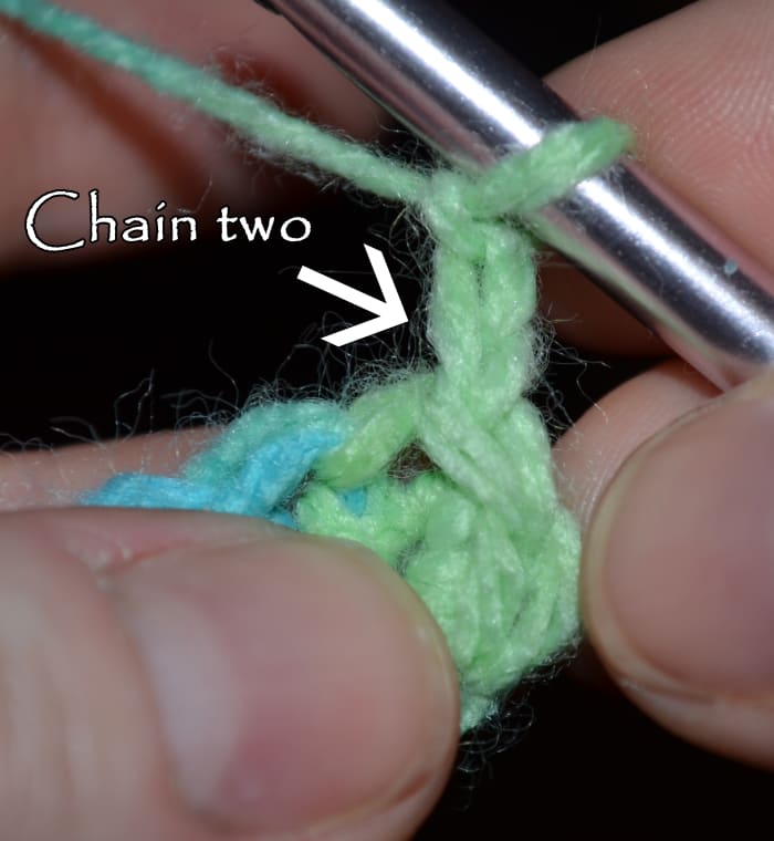 Chain two then complete a half double crochet in the same stitch (which is the slip stitch you made to finish the first round).