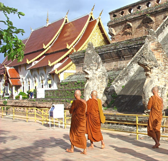 Buddhist monks at a Thai temple. Model release not required as the monks can't be identified from this shot.