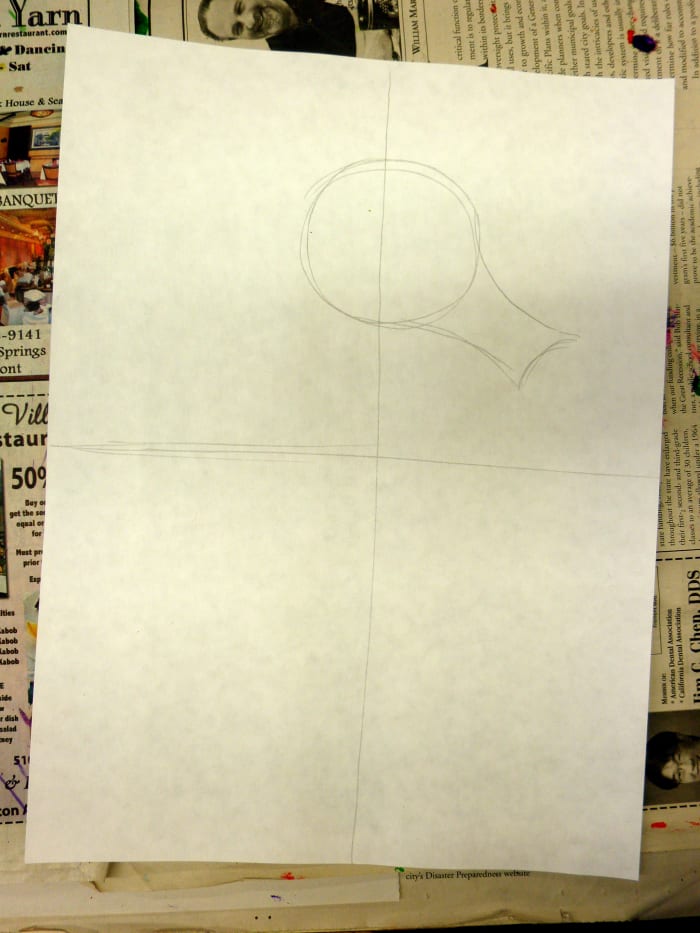 In this first part of this art lesson draw your guideline like a cross. Make these light. Then draw a circle with a snout to begin your sea horse drawing. Notice where I placed the circle. Make sure your paper is "portrait" style.
