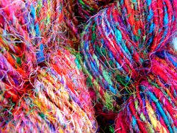 Silk sari yarn is brilliantly coloured, thin and very flexible. This is the preferred yarn for knitting and crotchet projects.
