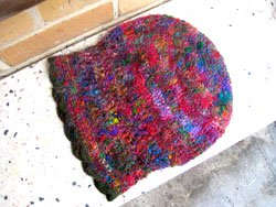 The shape of the hat - it doesn't matter if you crotchet it wider at the top as long as you get it to fit your head at the base.