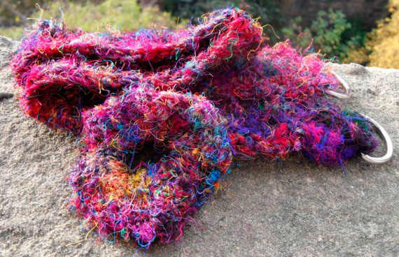 This brilliantly coloured recycled silk sari yarn crotcheted belt made my an Etsy crafter brightens up a winter outfit well.