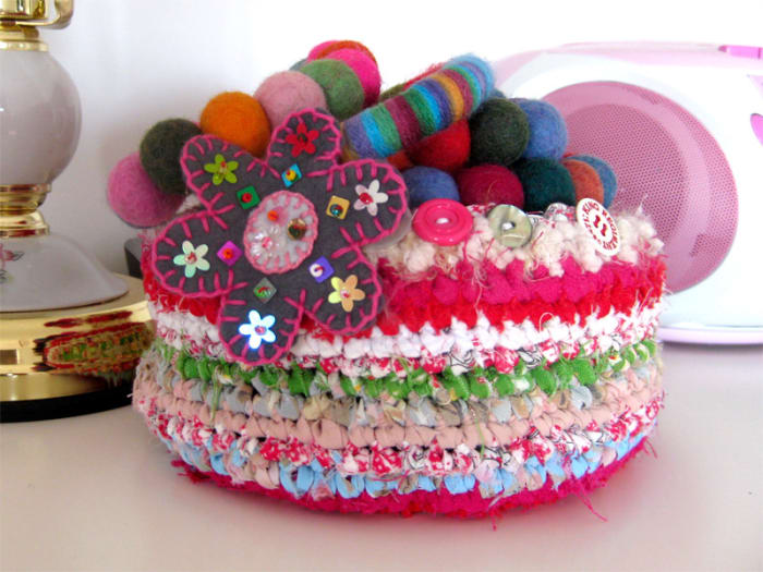 This fabric basket was made using the same technique as rag rugging, mixing 1cm fabric strips with fluffy wool to add texture.