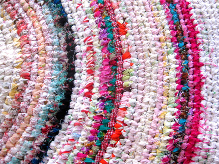 Obtain a mix of different coloured fabrics to work with. In this photo, I have used clothing, scarves, bedsheets, spandex and some spare leftover fabrics.