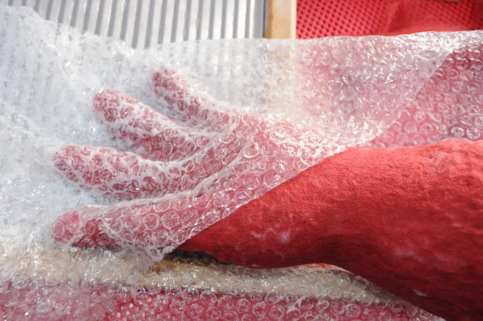 Cover fingers with bubble-wrap and push down between the fingers. Rub with your fingers for several minutes.