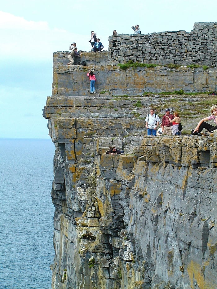 I was sitting about 2 feet out on a spur of rock over the Atlantic while taking this photo. However the wide angle lens stretches perspective and makes it look scarier!
