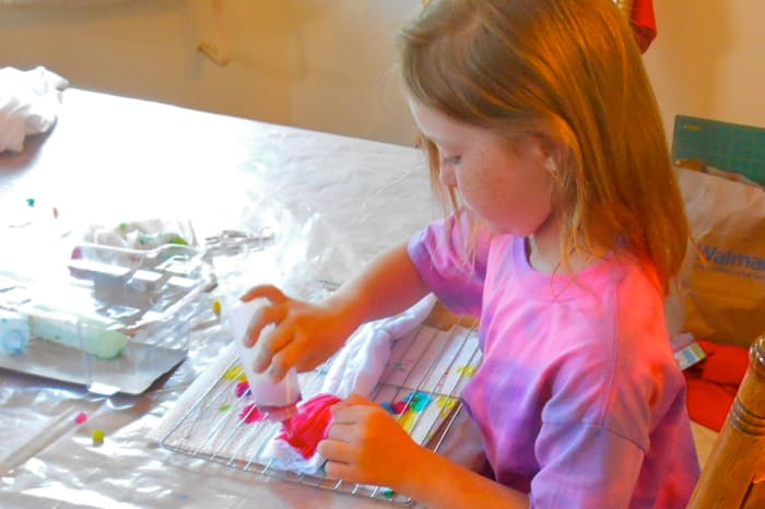 Becky folded her shirt for a Bull's Eye design, then carefully applied the dye. She did forget to put on her gloves, though!