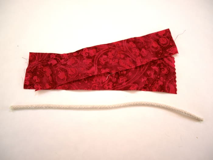 I did not have long strips of this fabric so I used 2 strips and a length of cord for this bracelet.