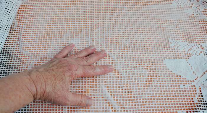 Force the hot soapy water outwards towards the edges and then rub gently until smooth