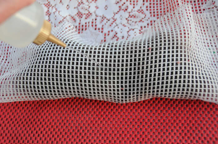 Pull the netting up and around the wool, wet and smooth the fibers down until the shoe last is evenly covered.