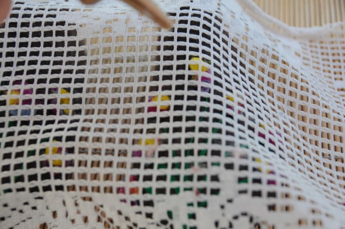 Cover with curtain netting, wet and rub well with fingers or using a piece of folded bubble-wrap. Keep on checking the placement of the fibers to make sure none have moved.