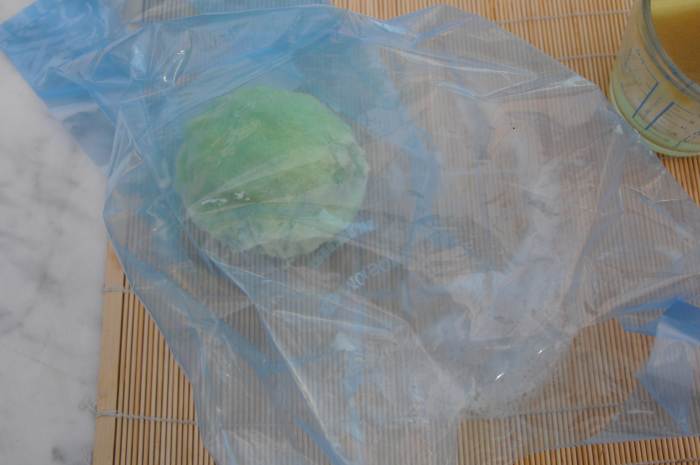Put a little hot soapy water into a plastic bag and roll gently until smooth. (An alternative to rolling on a sushi mat. I find the former easier.