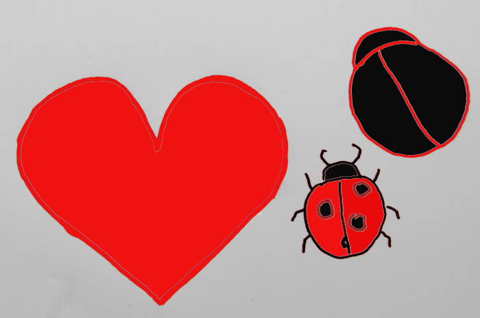 Draw hearts on a piece of thin plastic, cut the heart out an use this as a template for the needle felting.