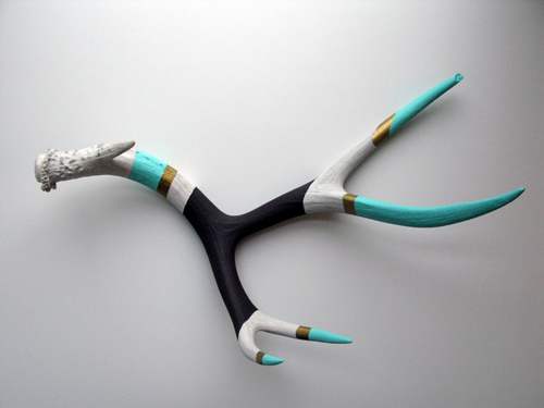 The artist here used combinations of matte and metallic acrylic paint to gussy up some otherwise drably colored antlers.