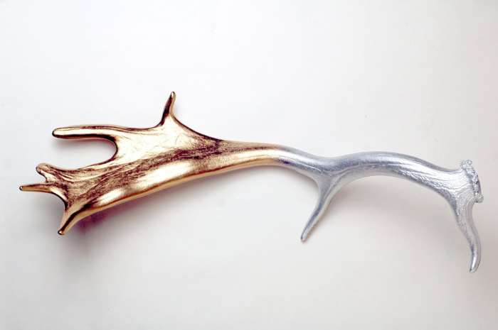 Not all antlers need to be Southwestern in style. This Fallow deer antler was covered in metallic silver and gold spray paint to achieve a beautiful, shiny gradient.