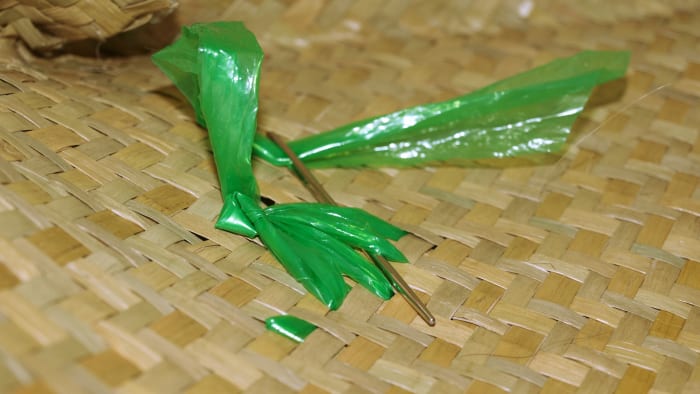 Make sure to securely tie off the design in the inside of the straw bag so that the sewing doesn't unravel.