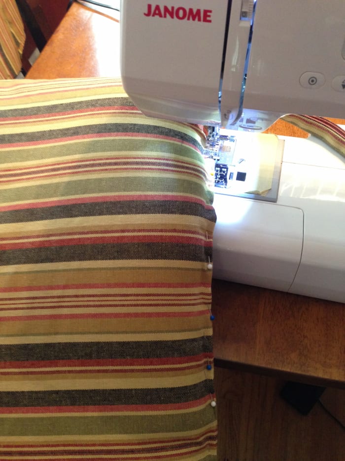 Since my cushions were rather thin, I decided to stitch the cover closed on the machine. It took a bit of wrestling and a lot of pins, so if you don't want to do this you can sew the opening closed by hand using a slip stitch.
