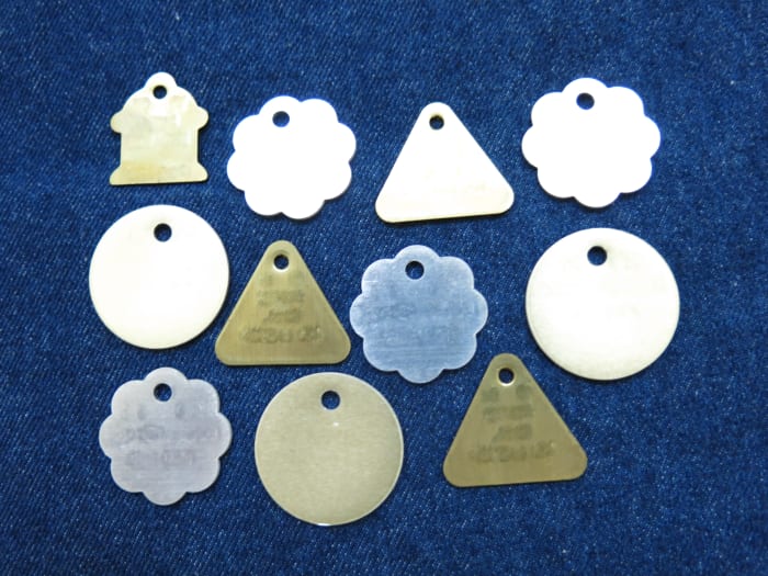 Pet ID tags can be used to make your own jewelry charms. You can then add more decoration to create and personalize your charms!