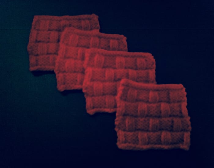 A fanned out picture of this knitted coaster pattern. Isn't it beautiful? It's also thick and sturdy - the characteristics you want in a coaster!
