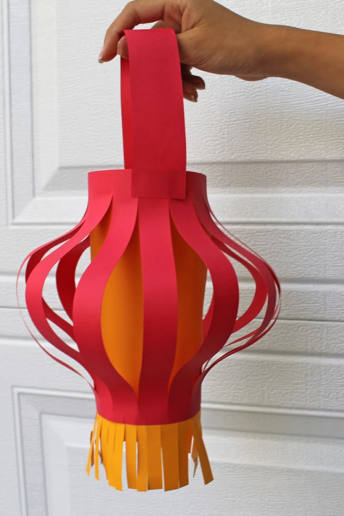 For this lantern, the top and bottom were not folded. The strips curve into a shape more like a hill than a half-circle.
