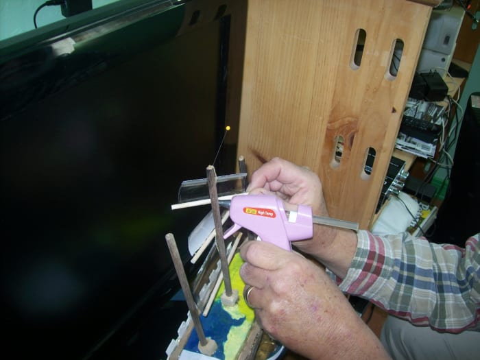 Note: This is an example of the sail connection. Paint the sails first. Hot glue works well for attaching sails to the mast.