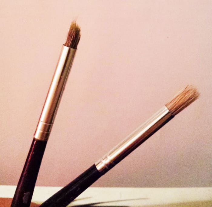 The brush on the left is my favorite brush for applying layers of paint. It gives a nice blend. It looked like the one on the right, brand new. If my fave brush goes kaput, I'll have to wait for the one on the right to become like it. Or find one.
