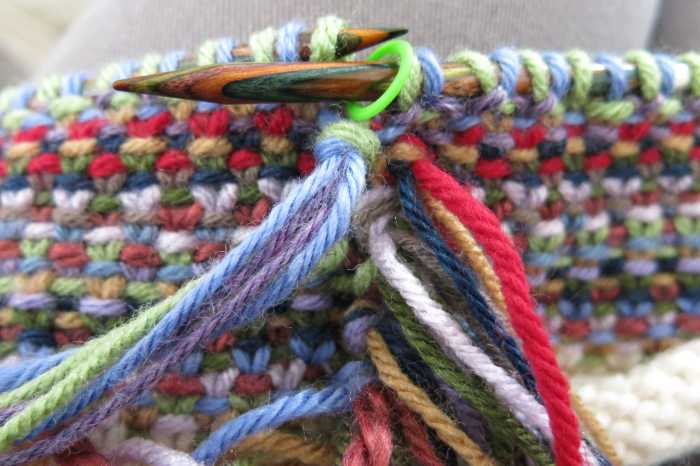 Wrap the strands around your finger to form a loop, and pull your ends through the loop.