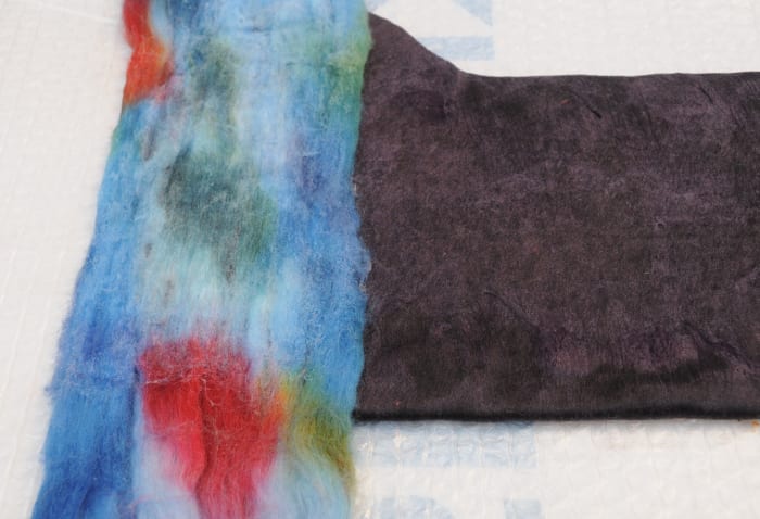 Place the opened up wool roving across the width or the length. Wet, turn over the repeat on both sides.