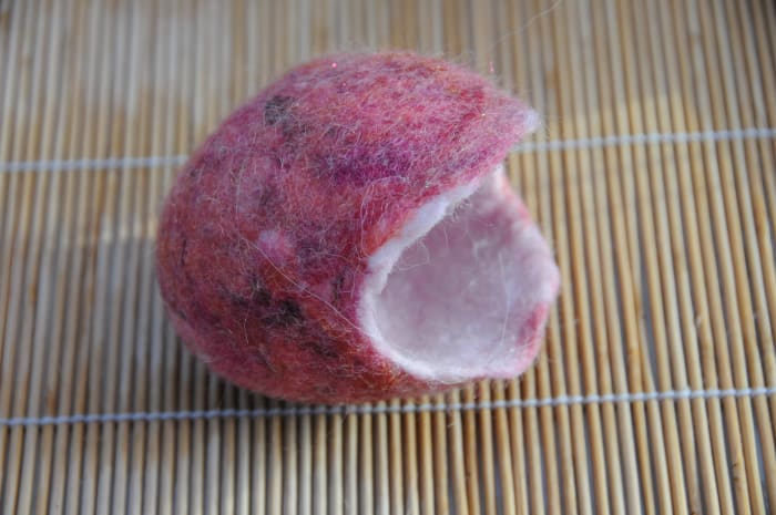 After having been completely felted in the tumble dryer with the cling wrap and party balloon removed.