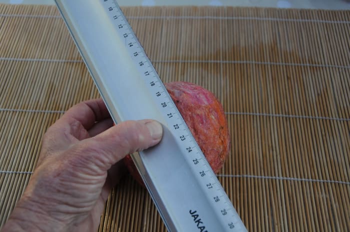Press a cutting line into the fabric of the felt using a straight edge and a pair of small scissors.