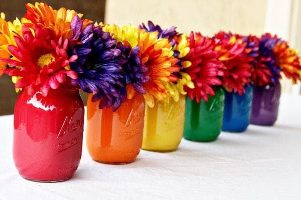 Mason jars can either be painted, or you can find multicolored mason jars that are ready to order if you're pressed for time!