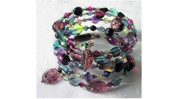 One-of-a-kind coil bracelet designed by Margaret Schindel features a mix of contemporary and vintage glass beads on memory wire