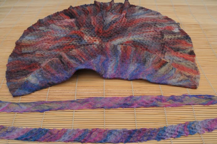 The project with the 2 chin straps before rubbing and rolling under first hot and then cold water.