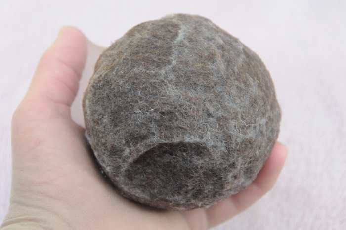 The wet ball ready to be put inside a pair of cut off tights before putting inside a tumble dryer.