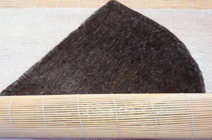Changing the direction in which you roll the project. Keep on turning it inside the bamboo blind.