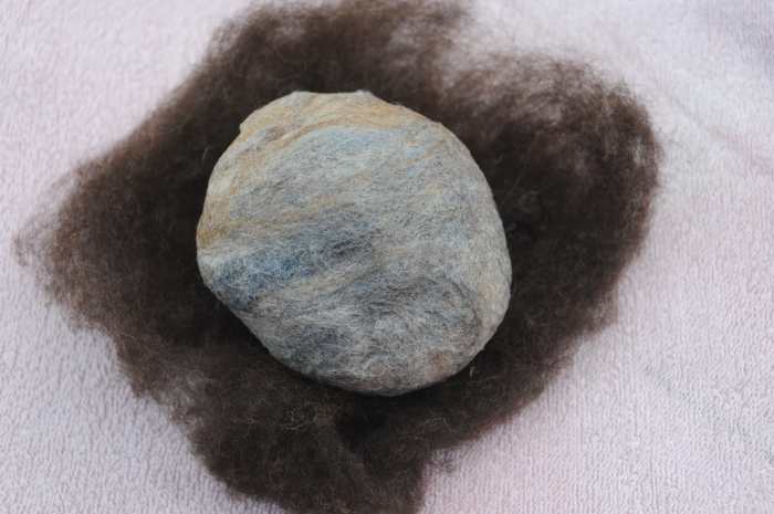 Wrap the oddments of wool roving with the same color roving as the hat and dreadlocks.