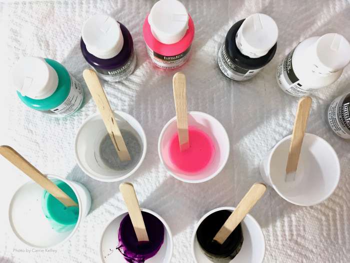 For small pour paintings (8x10" or smaller), 3-ounce (88 mL) plastic cups are the perfect size for mixing paint and pouring medium.