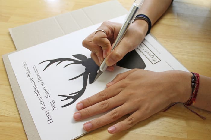 Print the template you've chosen onto card stock. Then, cut it out using a craft knife or pair of scissors.