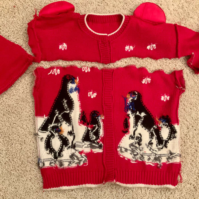 Design is centered and all seams are closed on this button front sweater. Leave a side open if you have a pullover sweater.