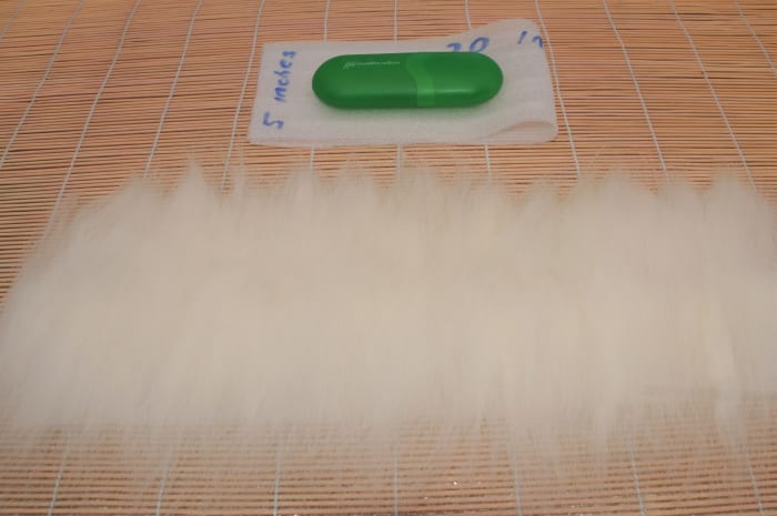 Spare template and glasses showing the length of the template. Shrinkage is calculated.