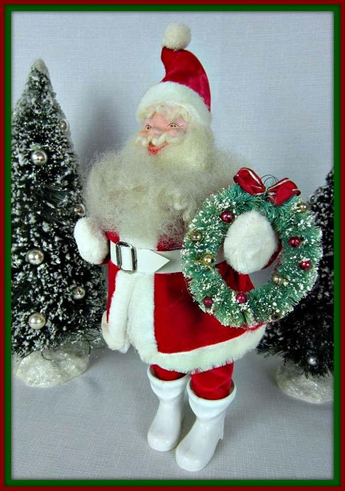 Red Velvet Suit, trimmed in plush. Original white vinyl belt. Woolly beard, mustache, and eyebrows. Hand Painted Face. Cheerful expression. Wearing original white boots. Standing approximately 16" tall to tip of cap.