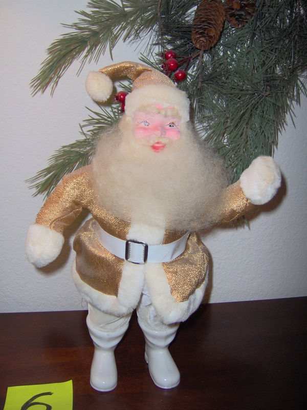 These remarkable well-made Santaâs came in red, gold, green, white, and pink Santa suits and were very well made.