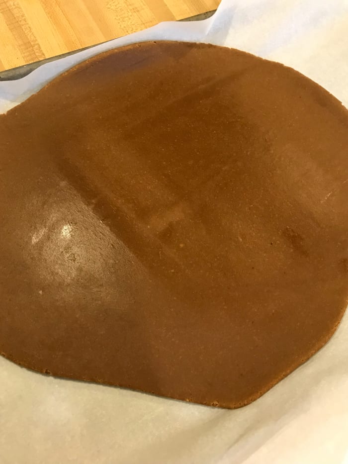 Roll the dough to about 1/4-inch thick. This part isn't exact, so don't worry too much. You do want a nice sturdy cookie for the ornament, so don't roll too thinly.